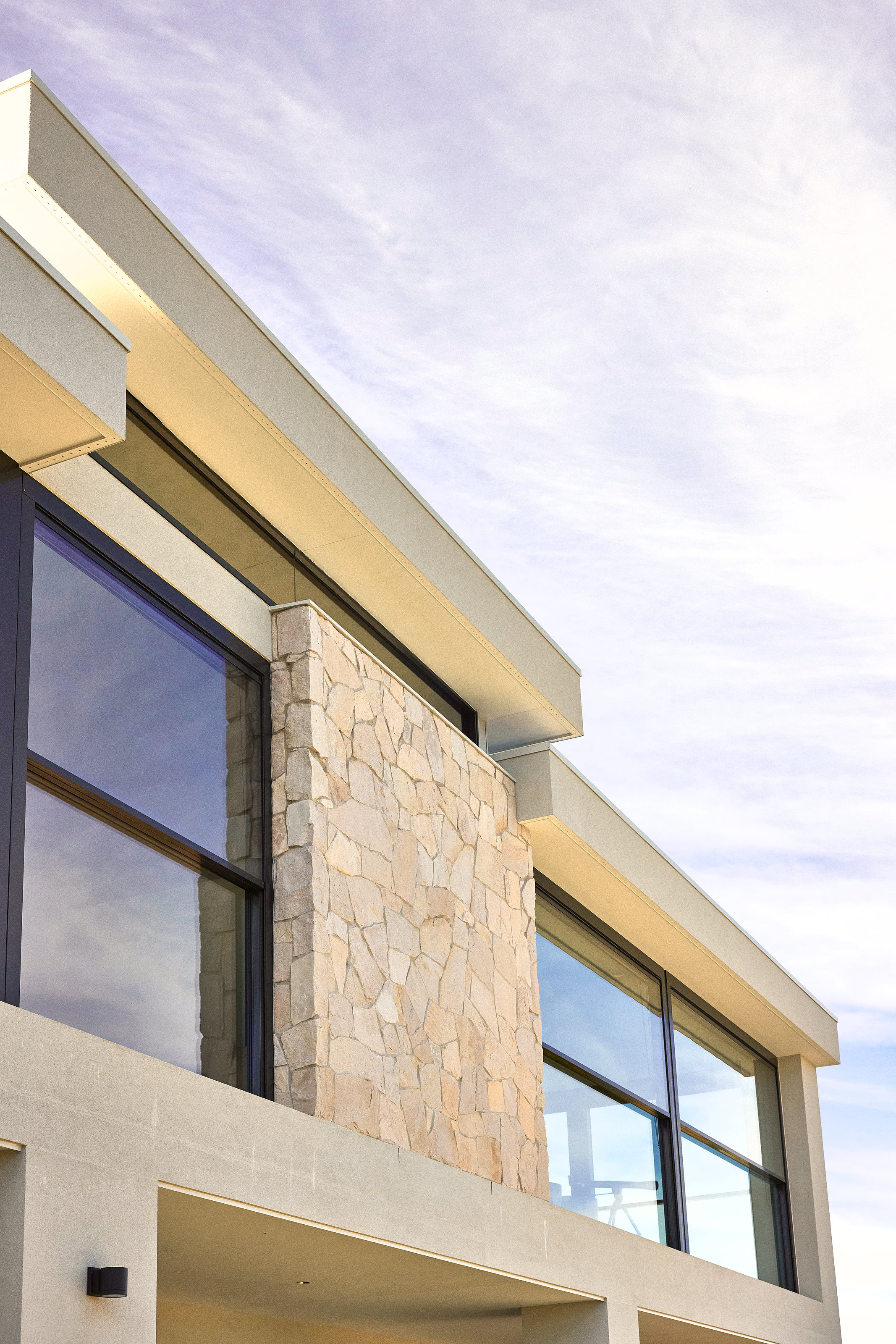 Palme Hus, eaves and clerestory glazing over the stone wall