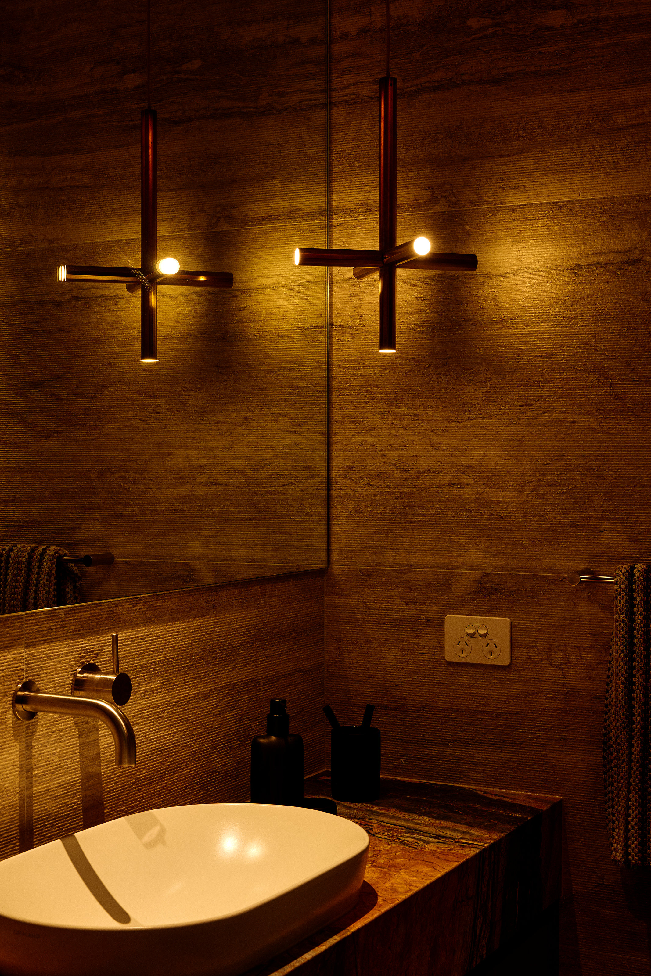 Palme Hus, bathroom in timber, wall lights either side of the mirror