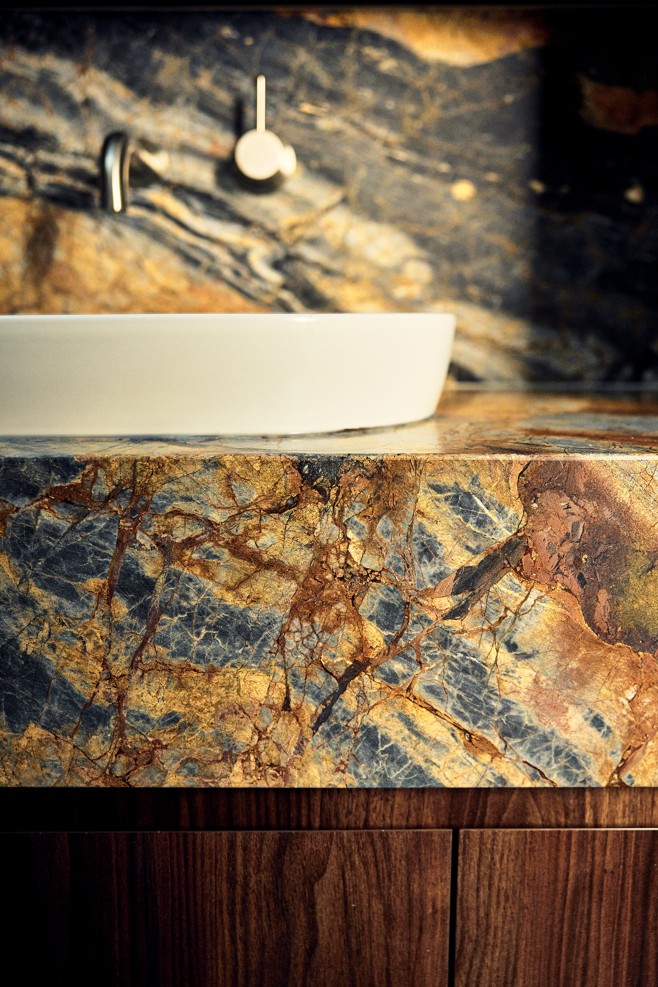 Palme Hus, basin and wall-mounted tapware on figured stone